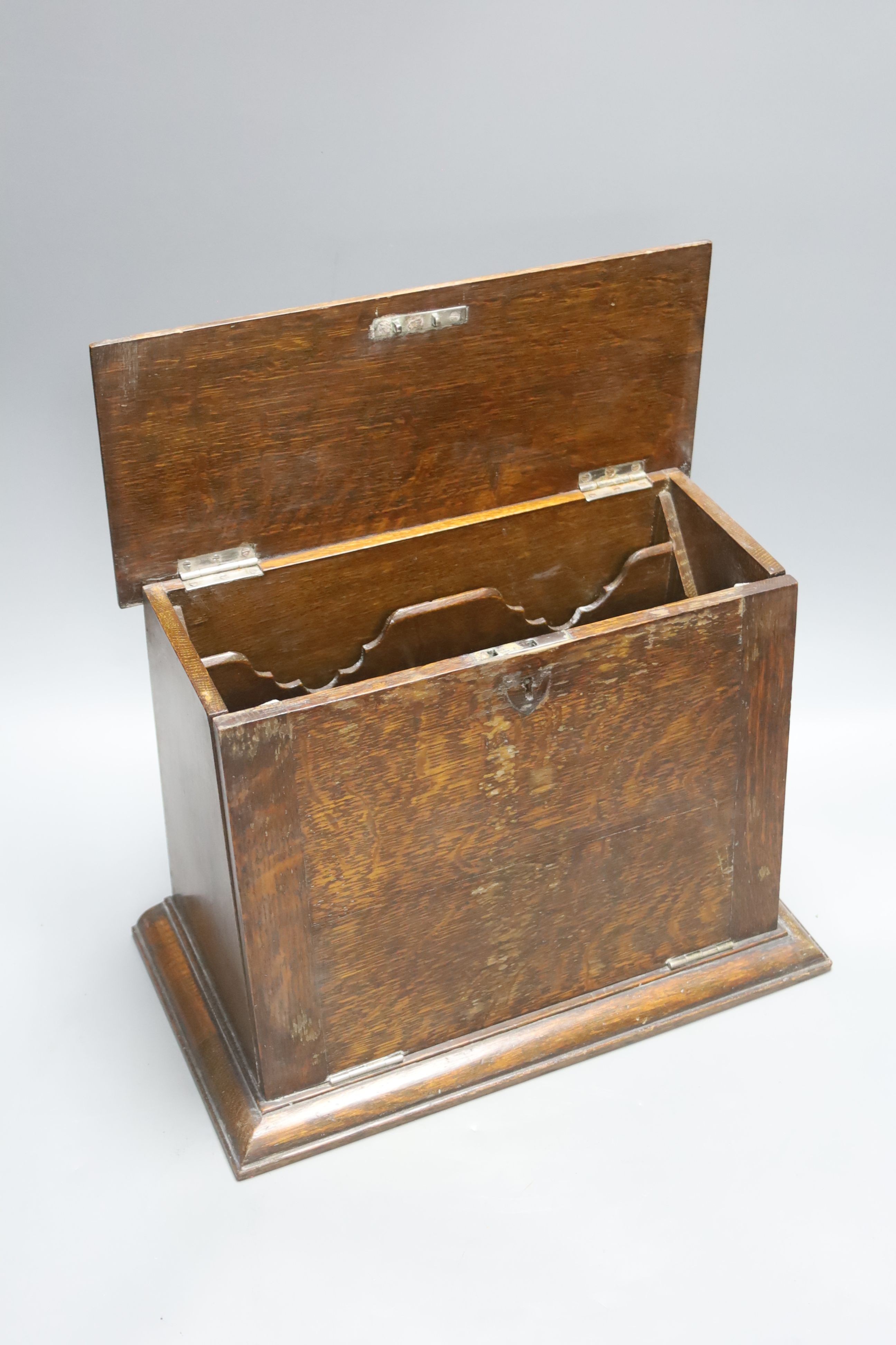 An Edwardian oak stationery box and an oak inkstand